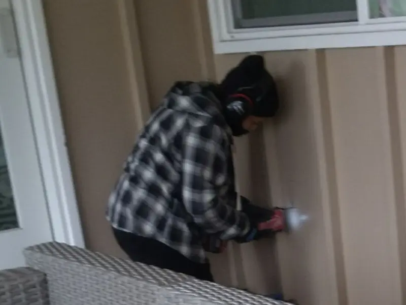 Professional electrician installing an exterior outlet in Jefferson